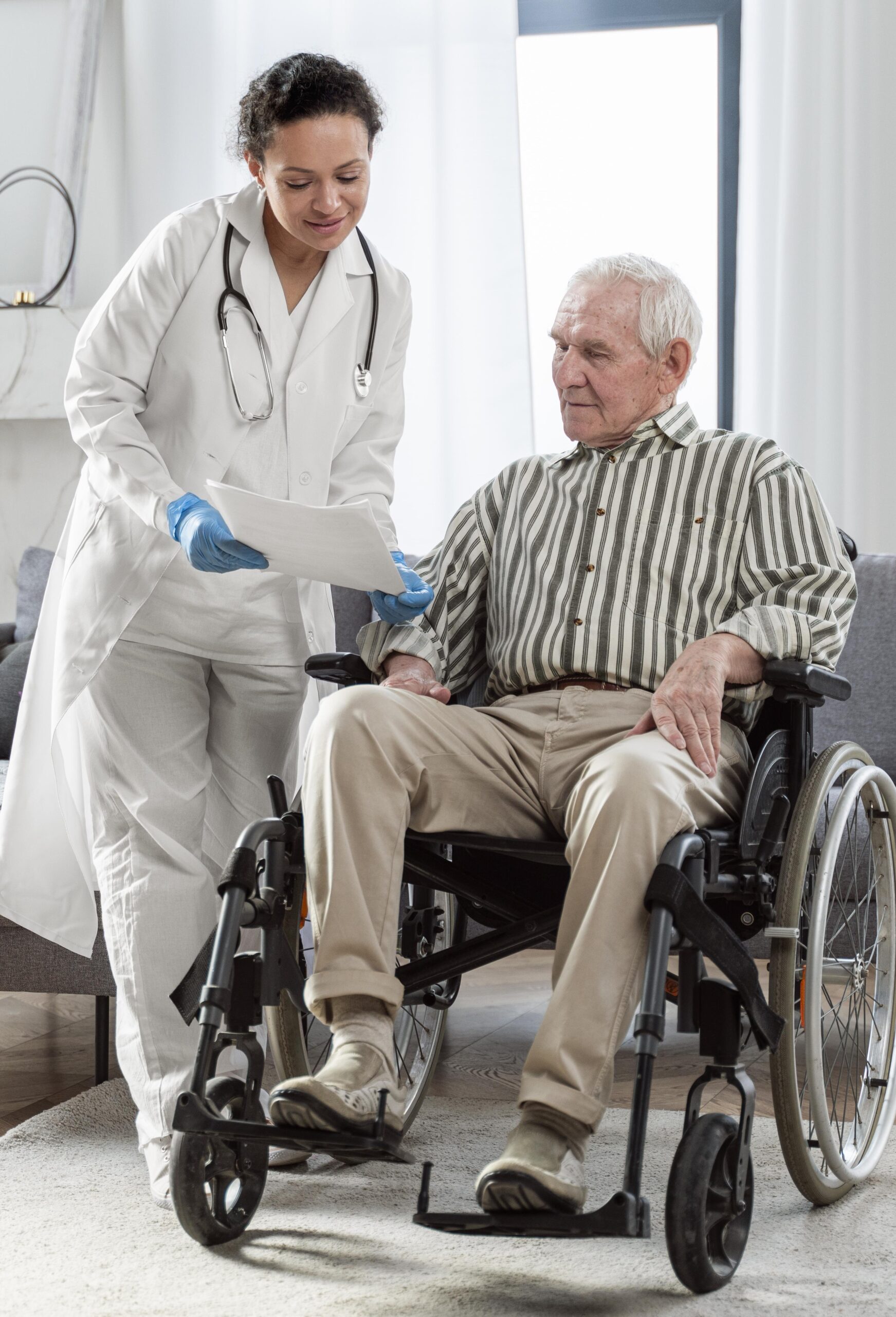 doctor talking senior man indoors scaled